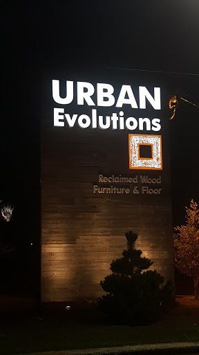 A sign for urban evolutions is lit up at night.