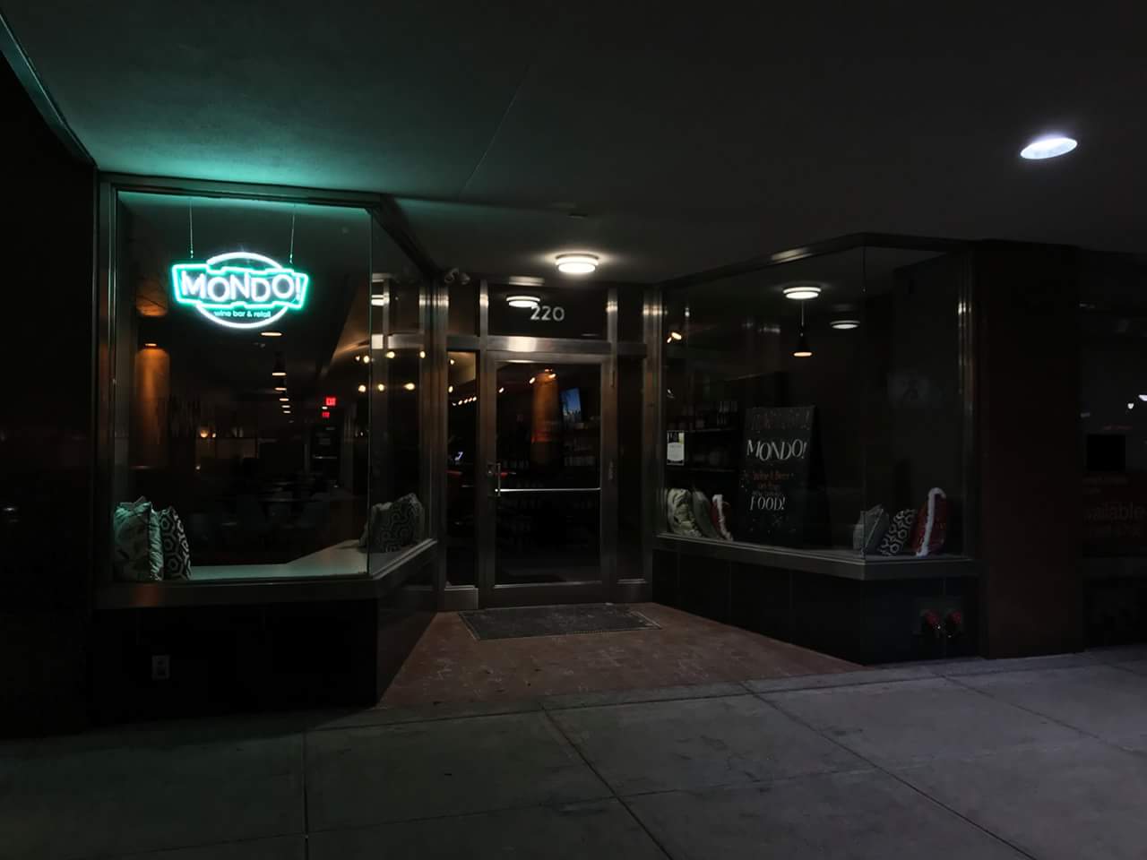 The word monday is on the neon sign above the door