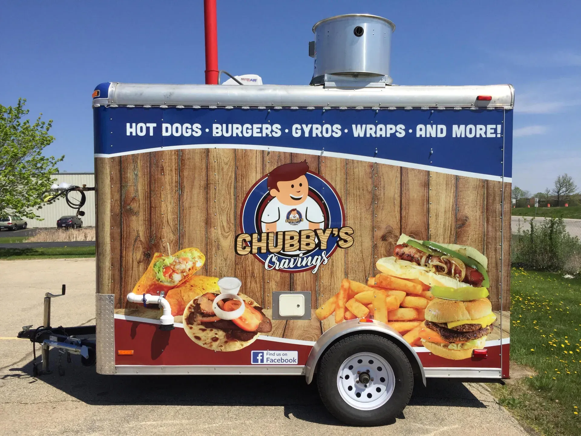Food trailer with vehicle wrap.