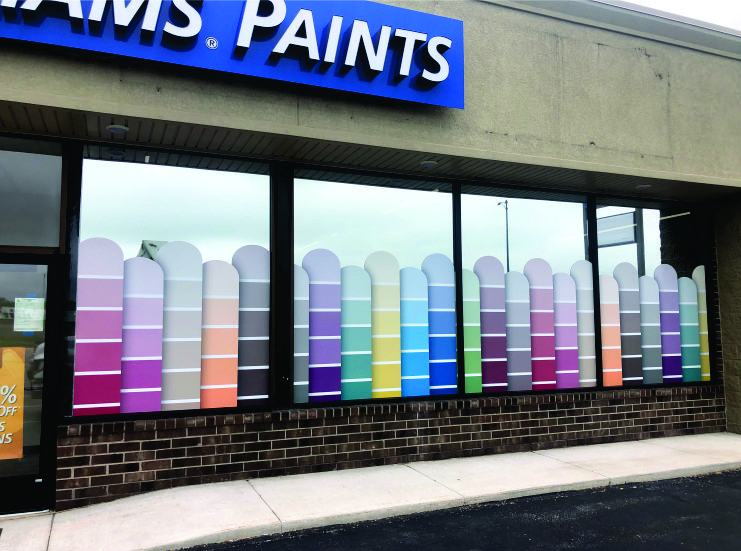 A building with a sign that says paints on it