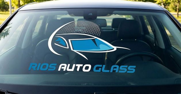 Front view of a car windshield with Rios Auto Glass logo decal.