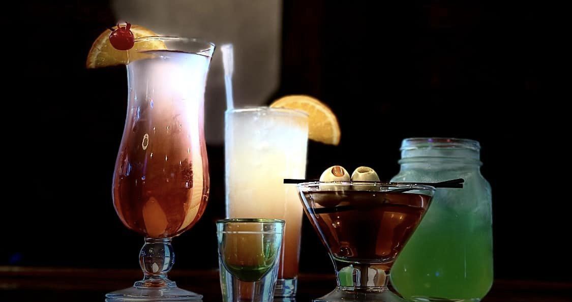 a variety of drinks are sitting on a table .