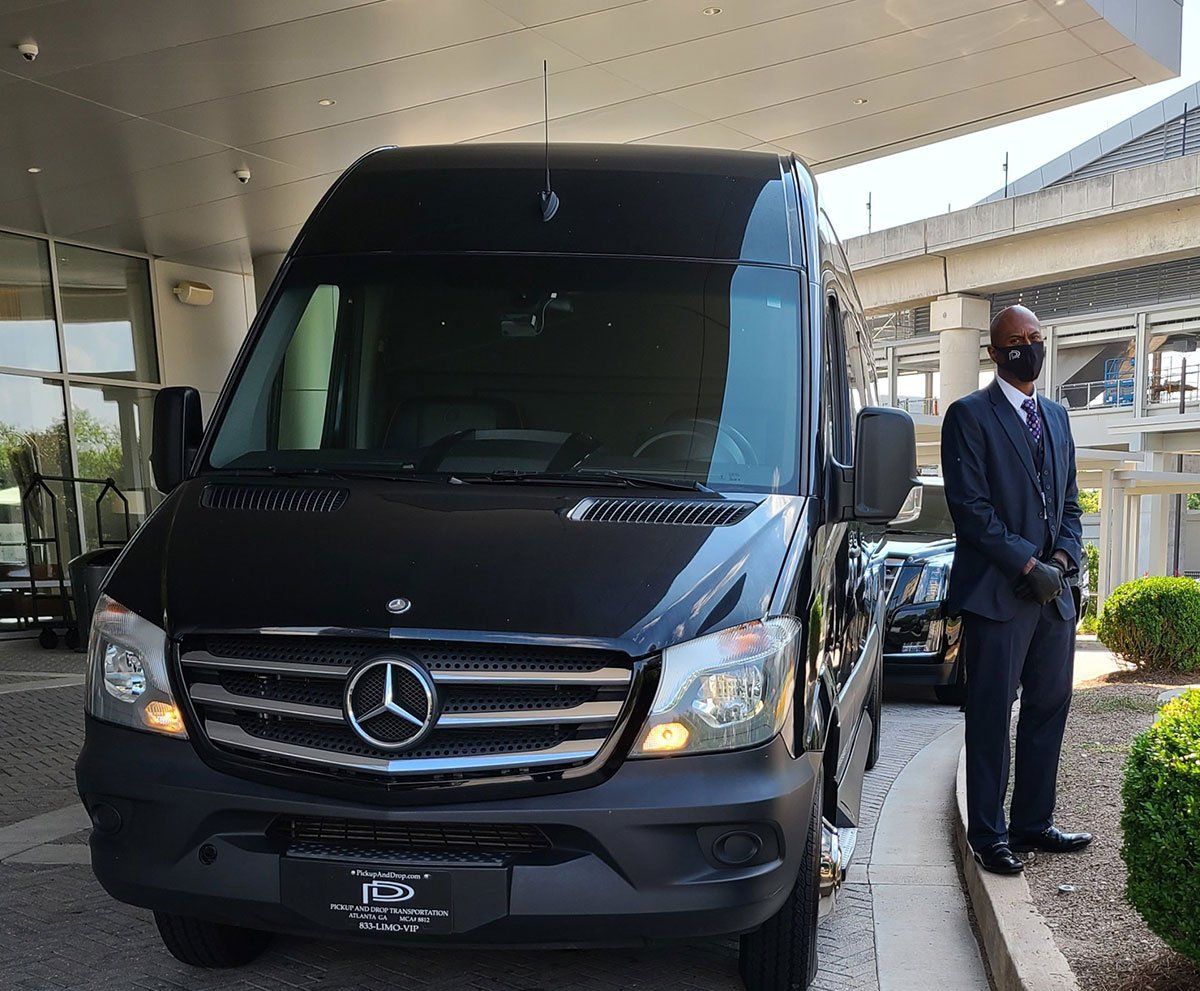 IMAGE OF A CHAUFFEURED DRIVEN BLACK MERCEDES SPRINTER VAN LIMOUSINE EXTERIOR TO BOOK FROM PICKUPANDDROP TRANSPORTATION & LIMOUSINES
