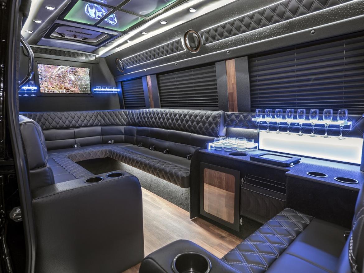 IMAGE OF A CHAUFFEURED DRIVEN BLACK MERCEDES SPRINTER VAN LIMOUSINE INTERIOR TO BOOK FROM PICKUPANDDROP TRANSPORTATION & LIMOUSINES