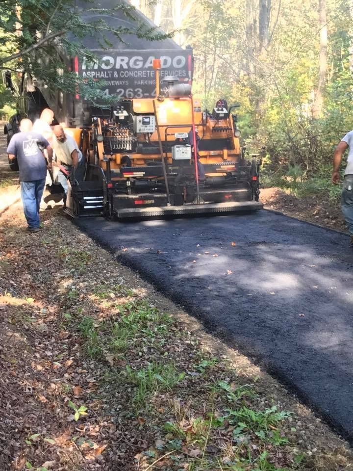 A road is being paved by a company called inorgado