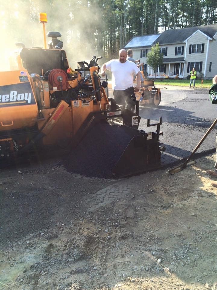 A man is standing in front of a machine that says ' reboy ' on it