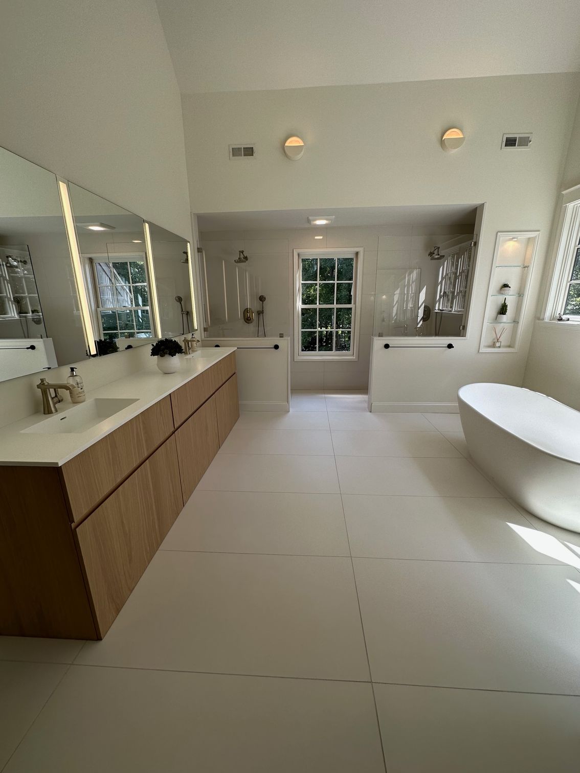 Glass enclosure and mirror on bathroom