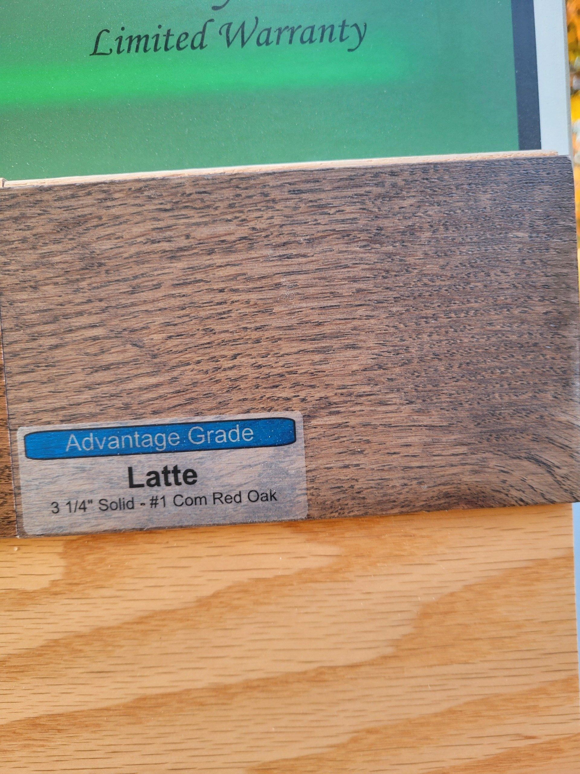 Close-up of hardwood flooring sample labeled 