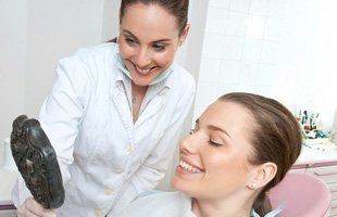 Dentist checking woman's teeth