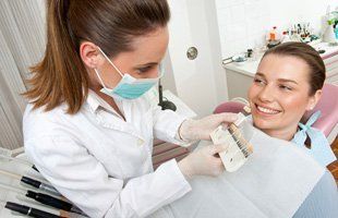 Dentist checking woman's teeth