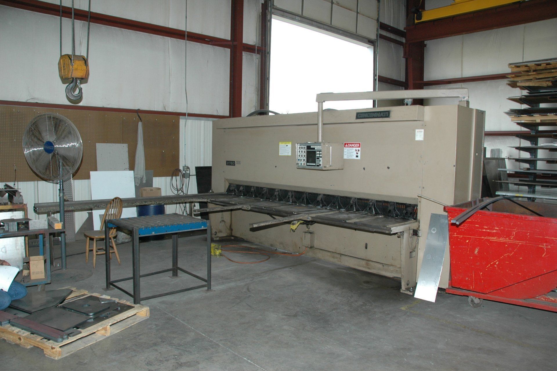 A large machine is sitting in the middle of a room.