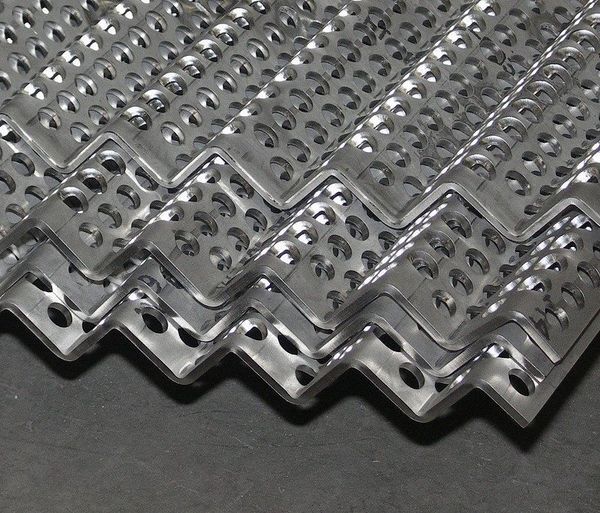 A close up of a piece of metal with holes in it