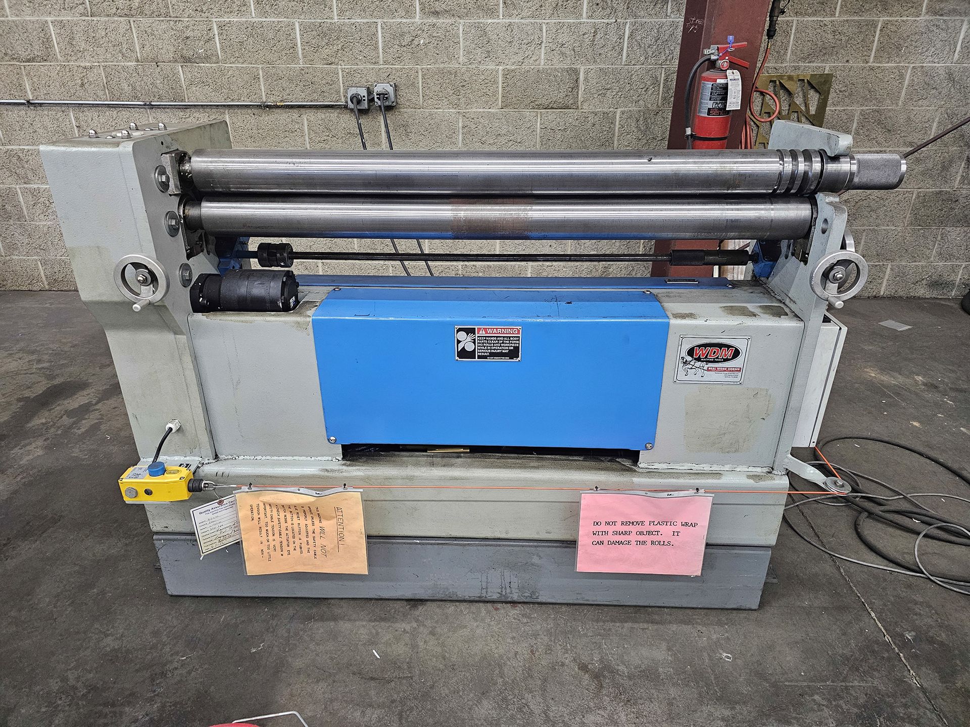 A machine with a sign that says ' warning ' on it