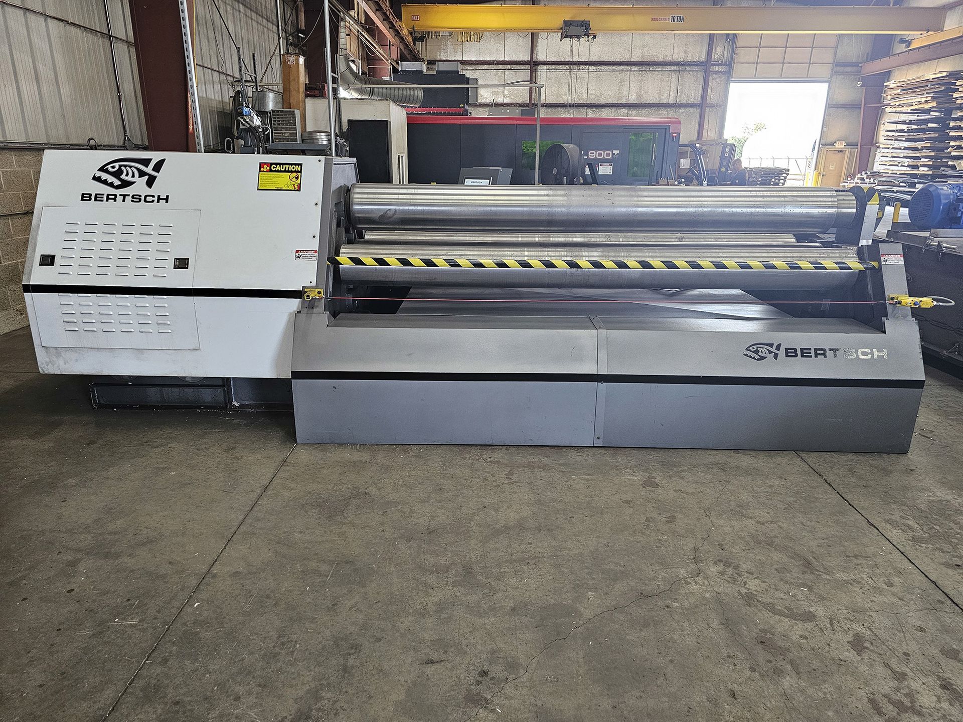 A large machine is sitting in a warehouse.