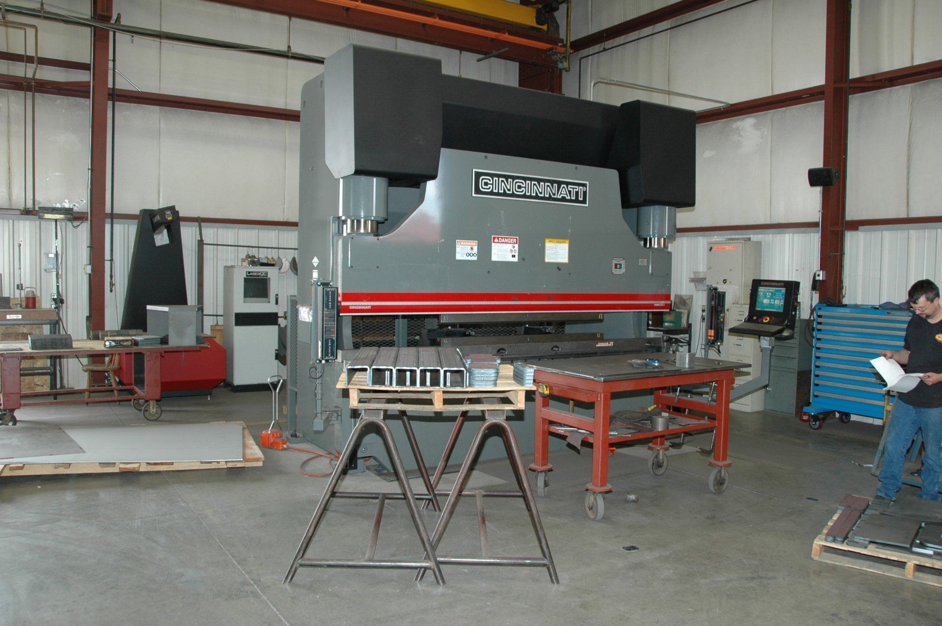 A man standing in front of a machine that says mothercraft