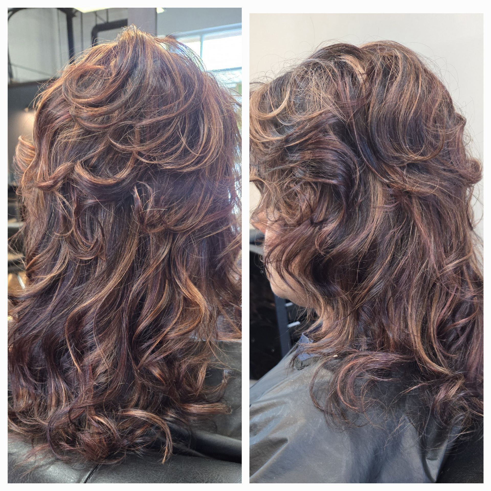 A woman with long curly hair is sitting in a chair in a salon.