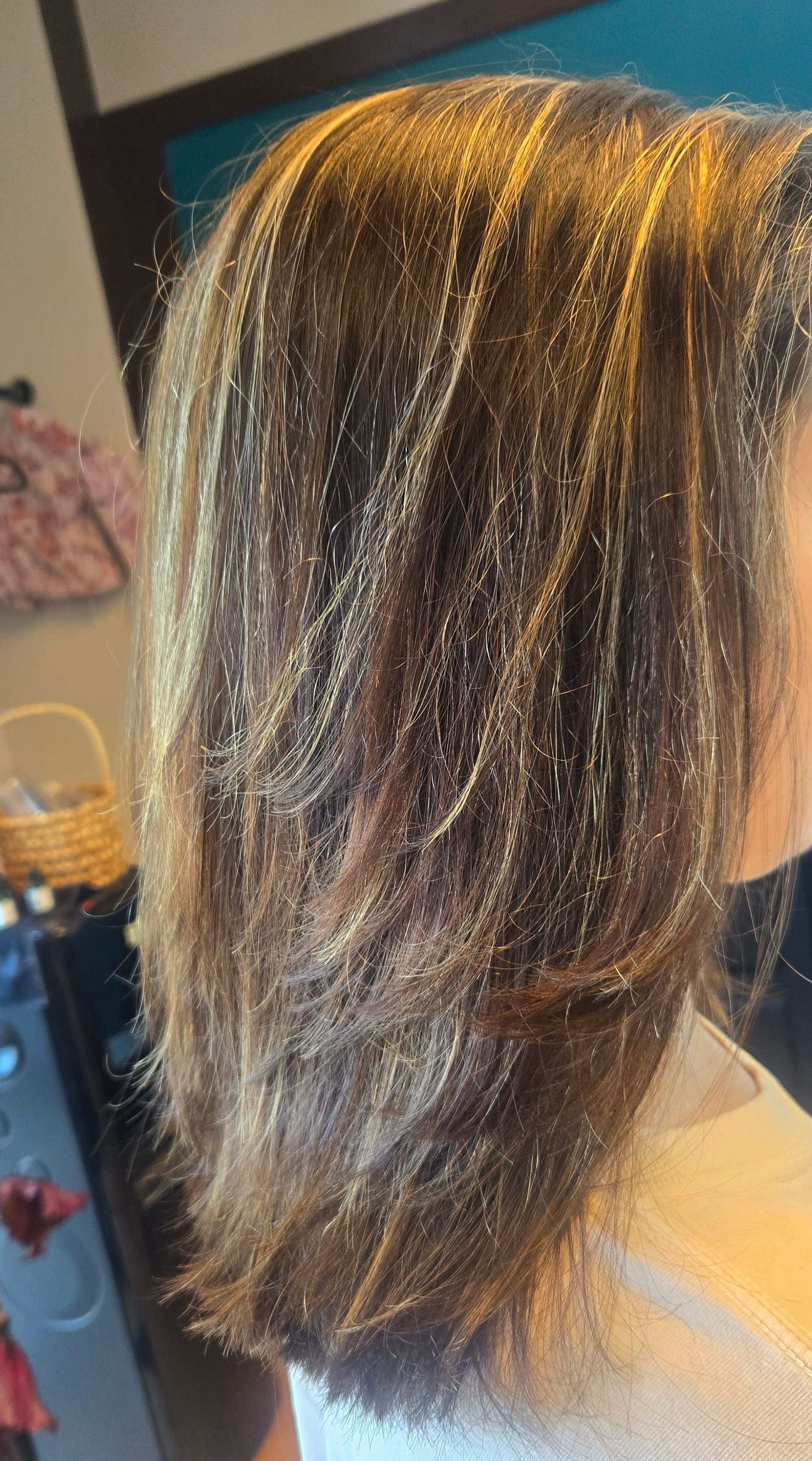 A close up of a woman 's hair with glitter.