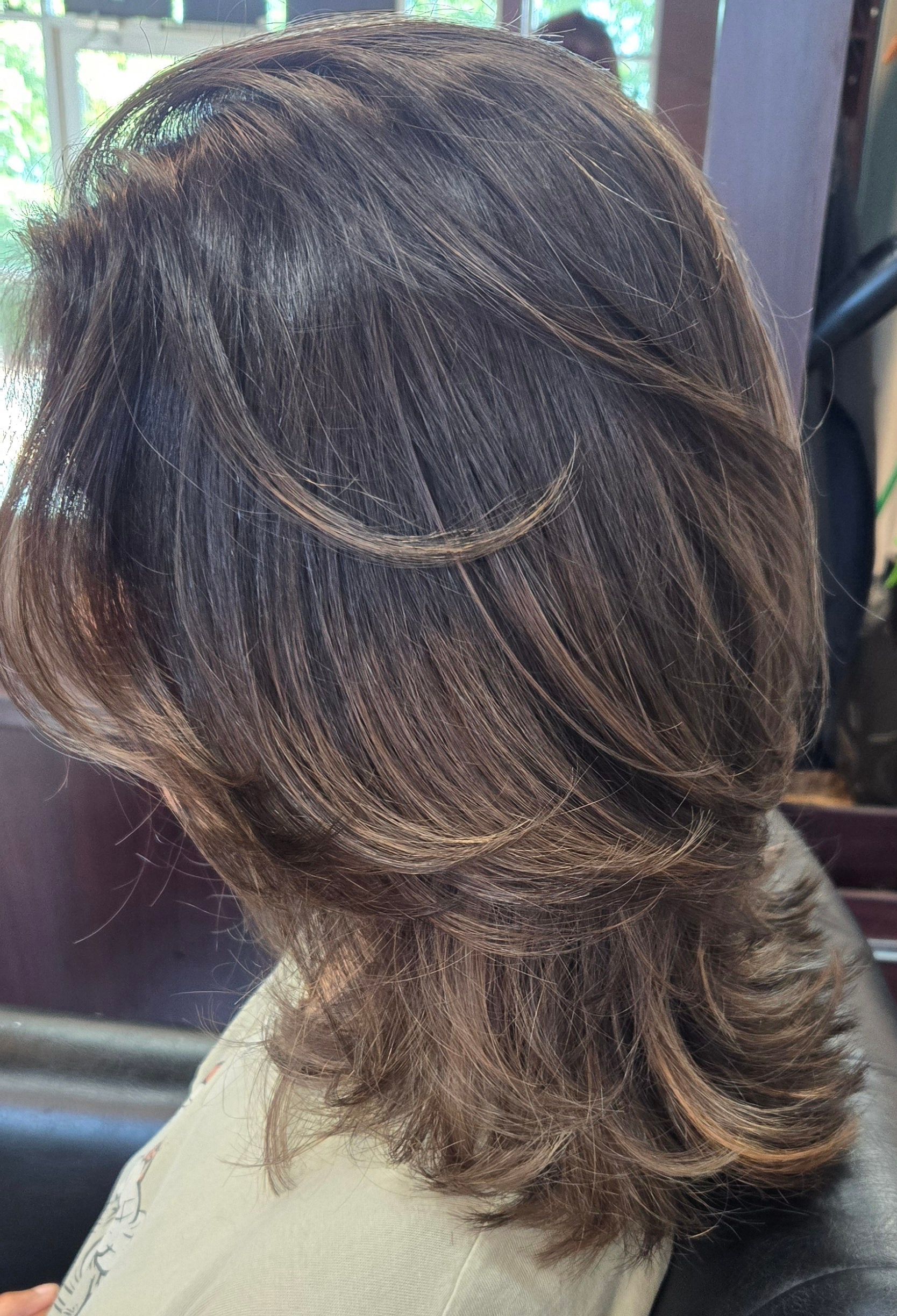 A close up of a woman 's hair in a salon.