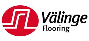 Välinge Flooring logo: a red circle with a stylized white 