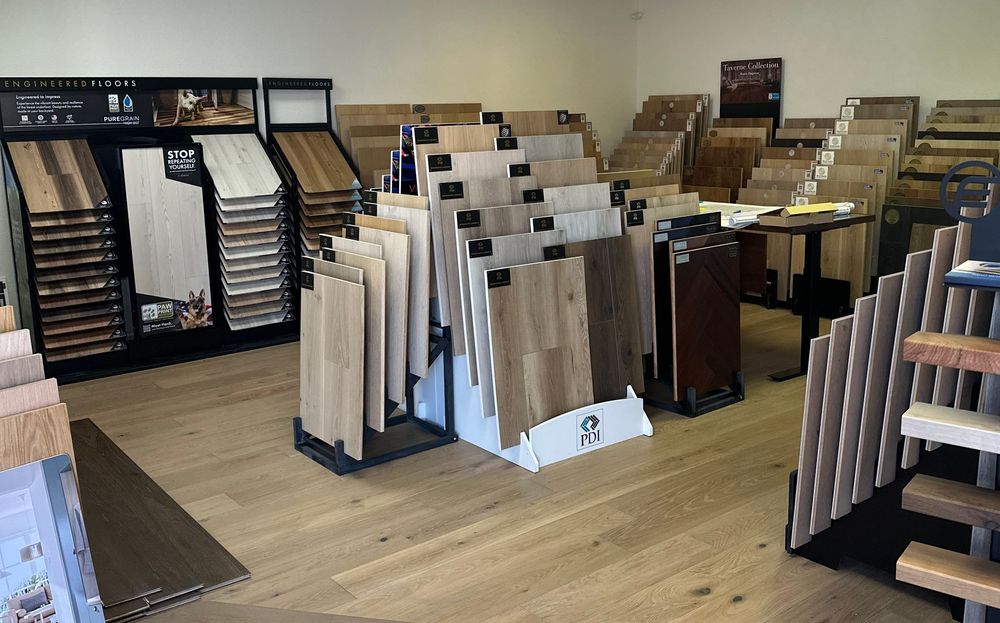 Flooring store with various wood and tile samples displayed.