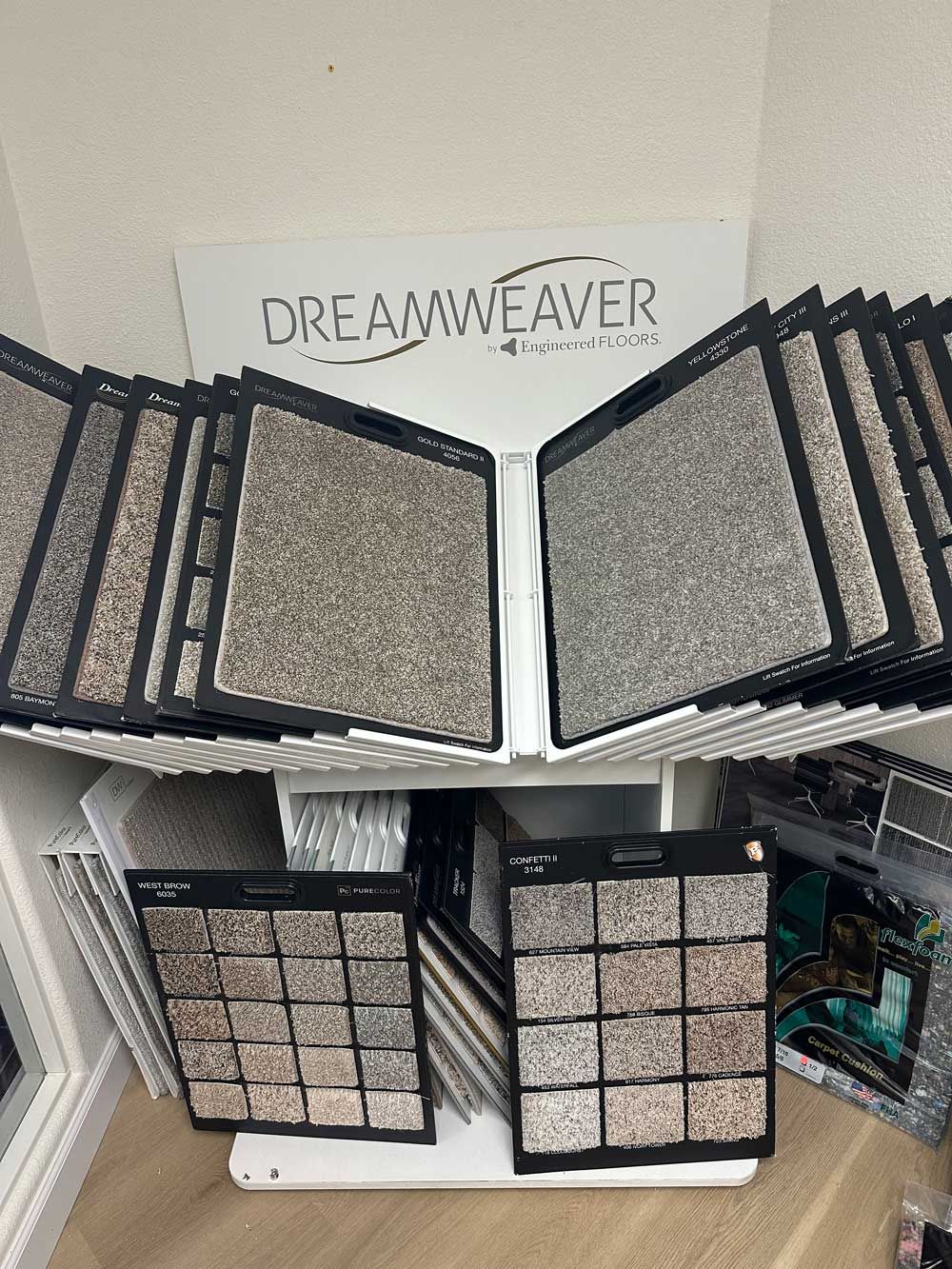 Carpet samples in a display, Dreamweaver logo visible.