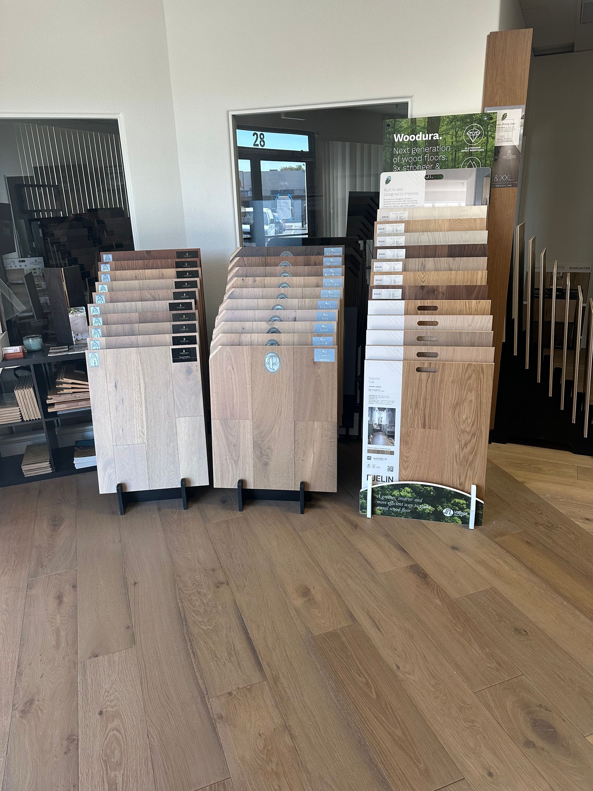 Wood flooring samples on display in a showroom.