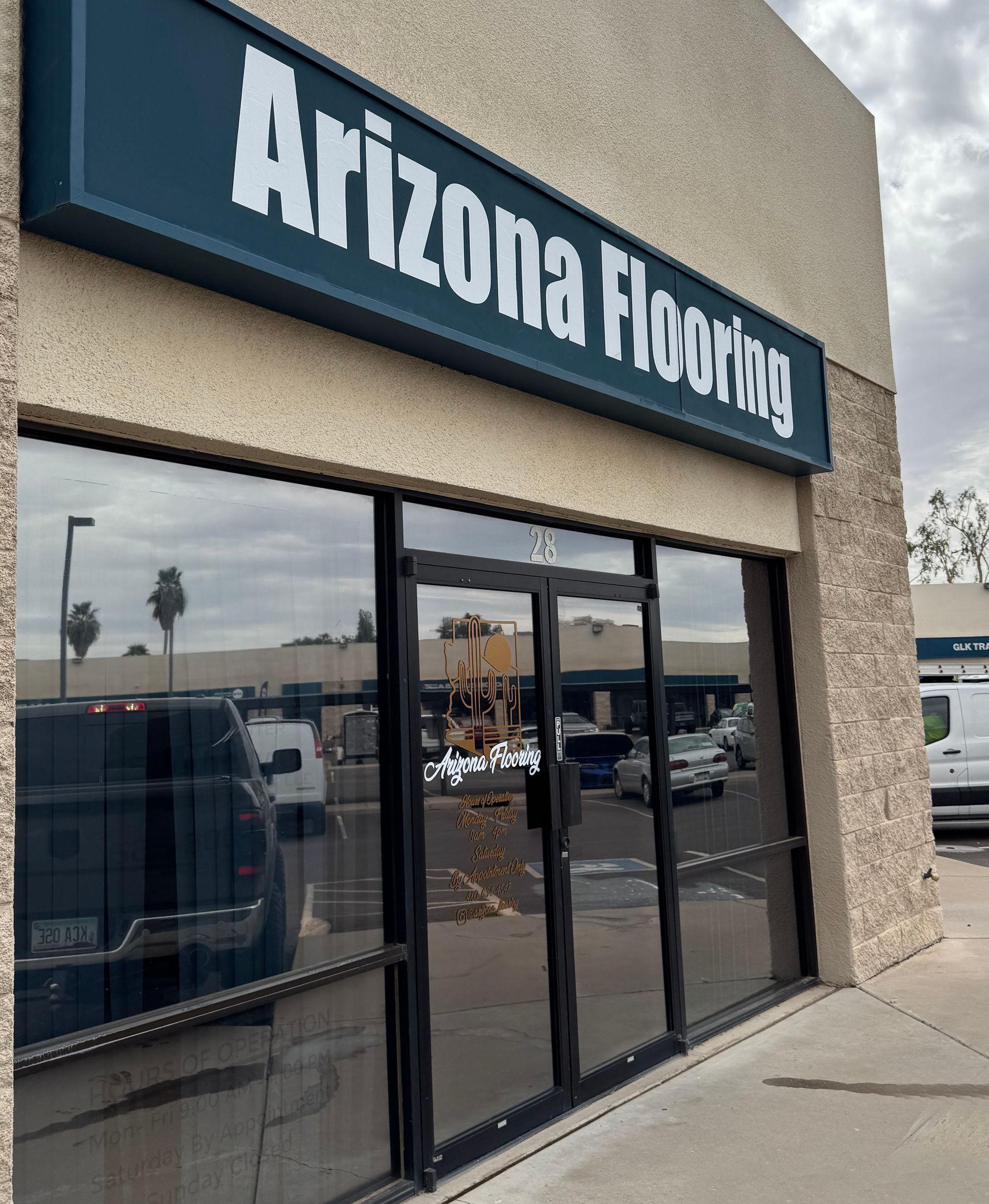 Arizona Flooring store front with large windows and a sign.