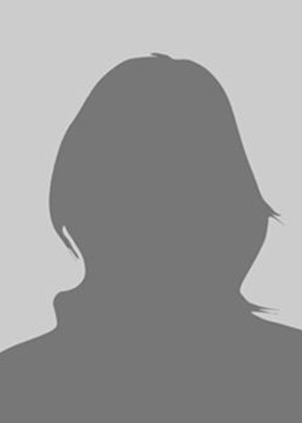 Silhouette of a person with short hair, against a gray background.