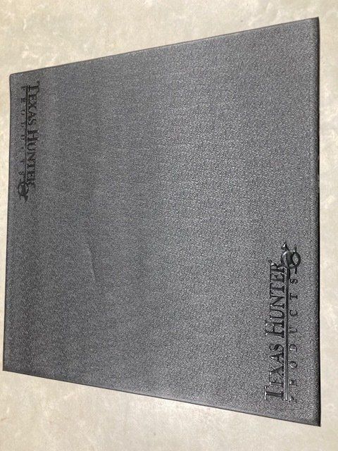 A book titled texas hunter sits on a table