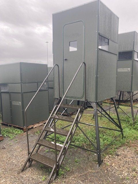 A small building with stairs leading up to it.