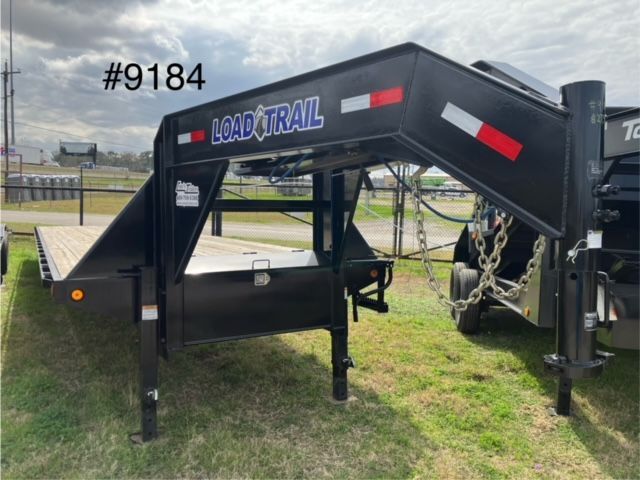 A black trailer with the word load trail on it