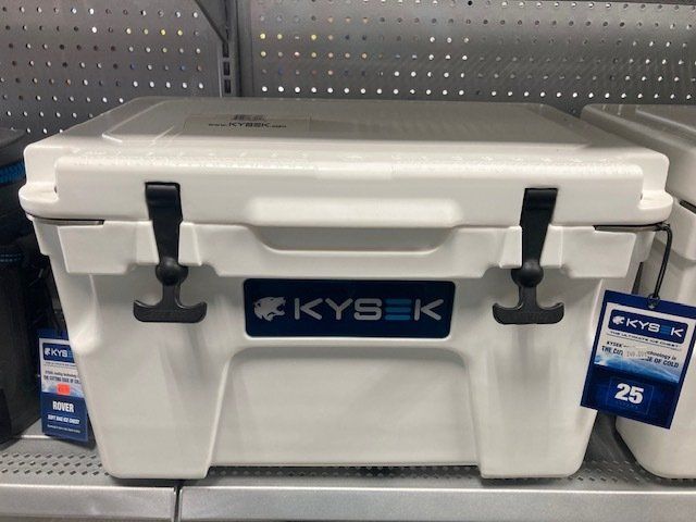 A white kysek cooler is sitting on a shelf in a store.