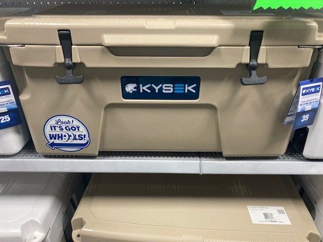 A kysek cooler is sitting on a shelf in a store.