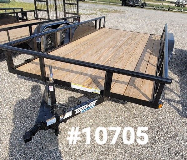 A black Top Hat utility trailer with a wooden floor sits on a gravel lot, marked with the inventory number #10705.