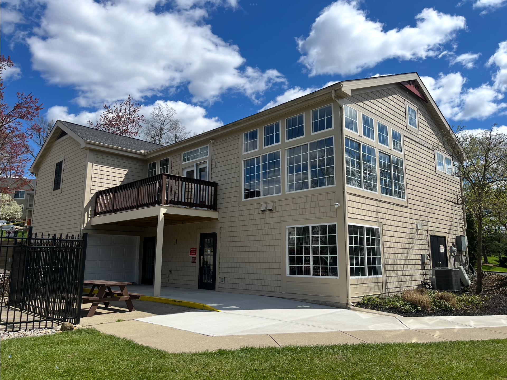 A large house with a lot of windows and a balcony.
