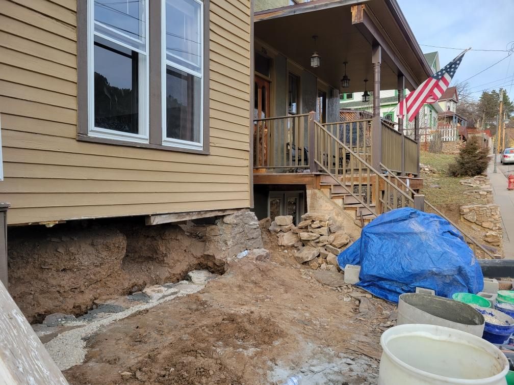 Tore down the old stone foundation