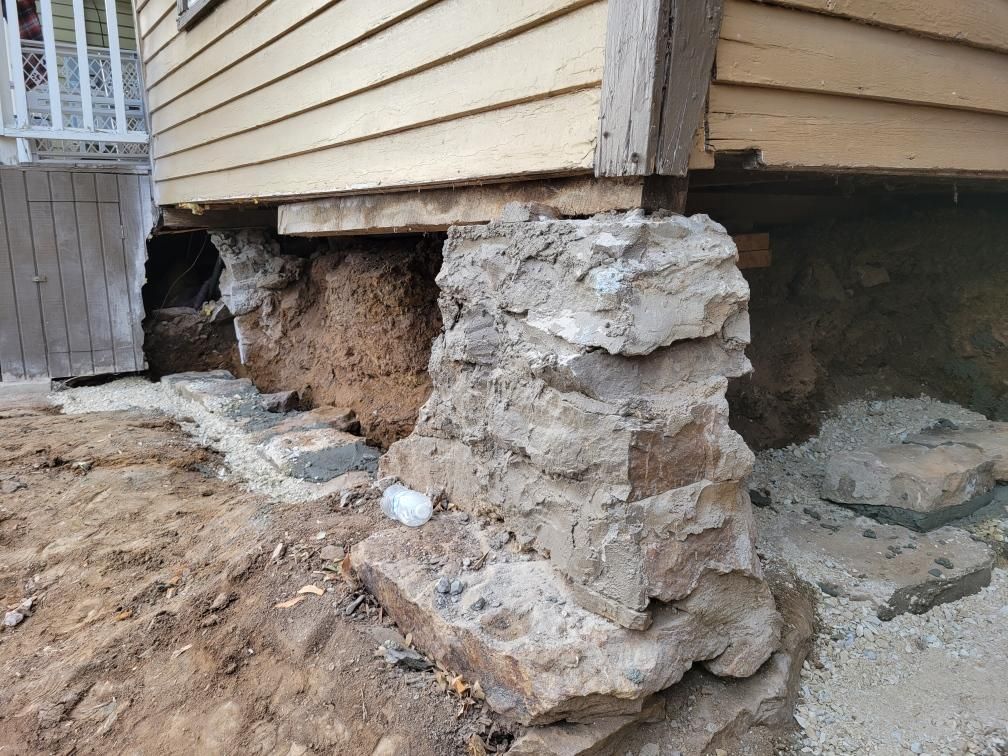 Tore down the old stone foundation of the house