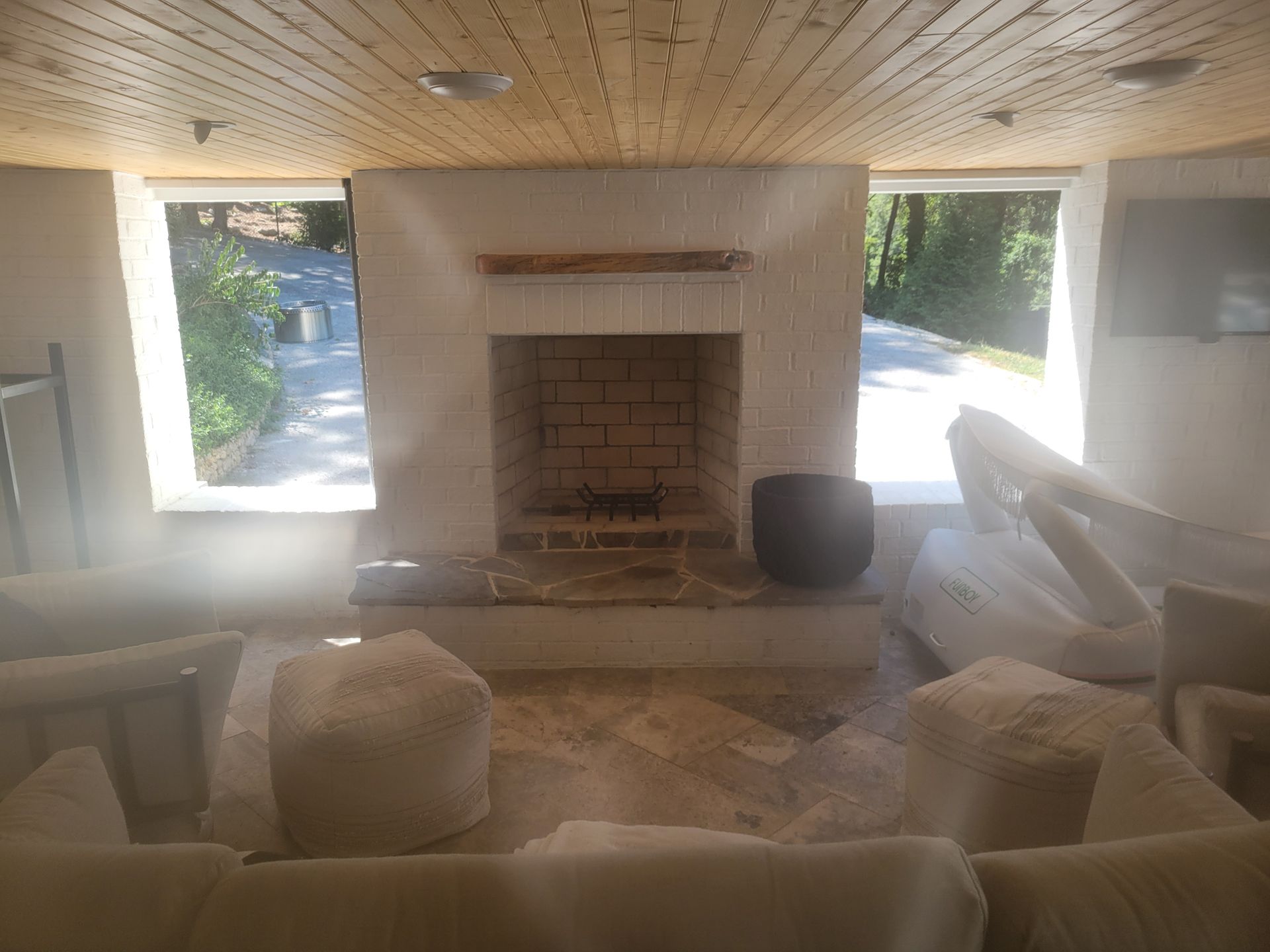 A living room with a fireplace and a couch.