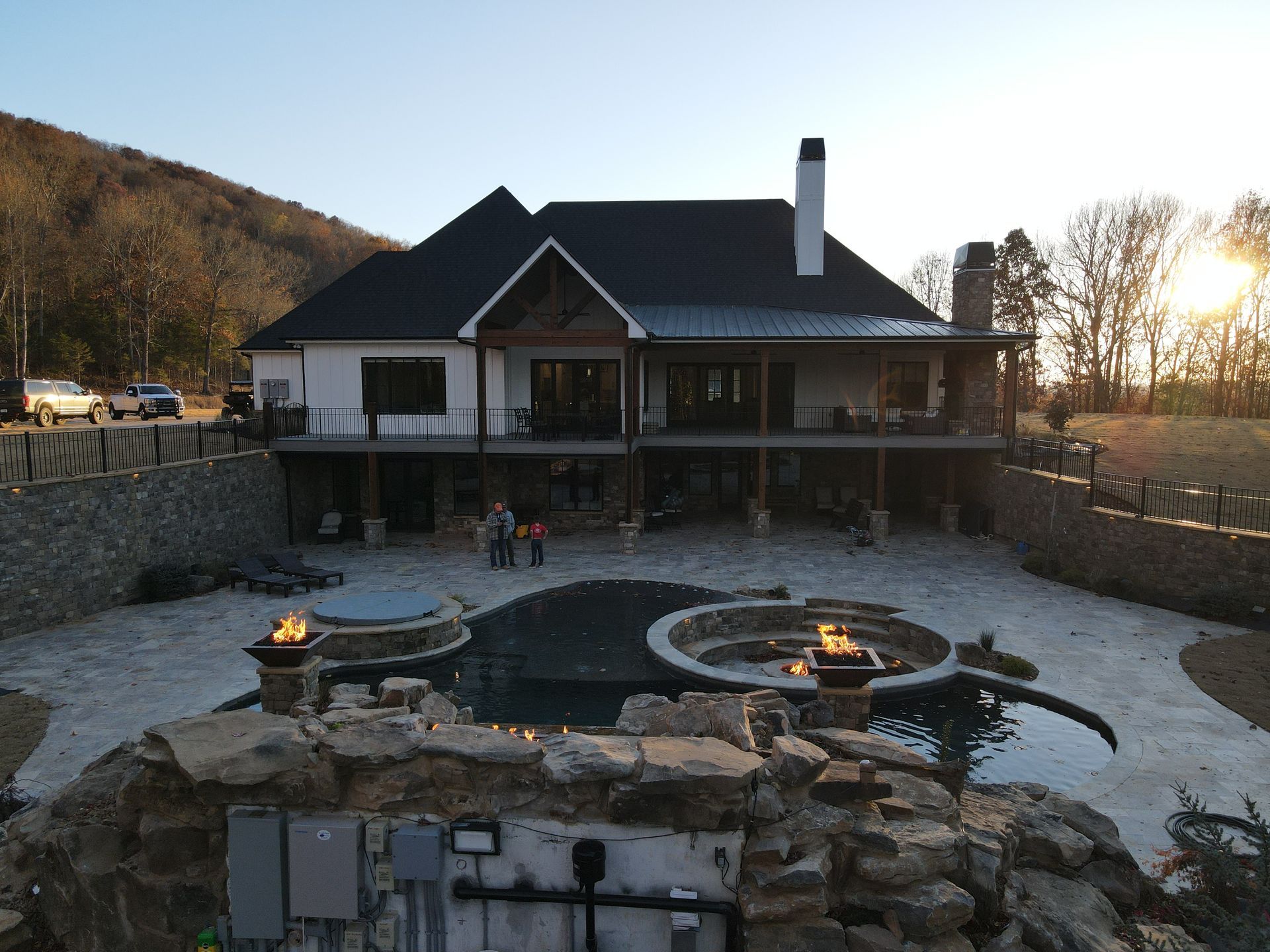 A large house with a large pool in front of it