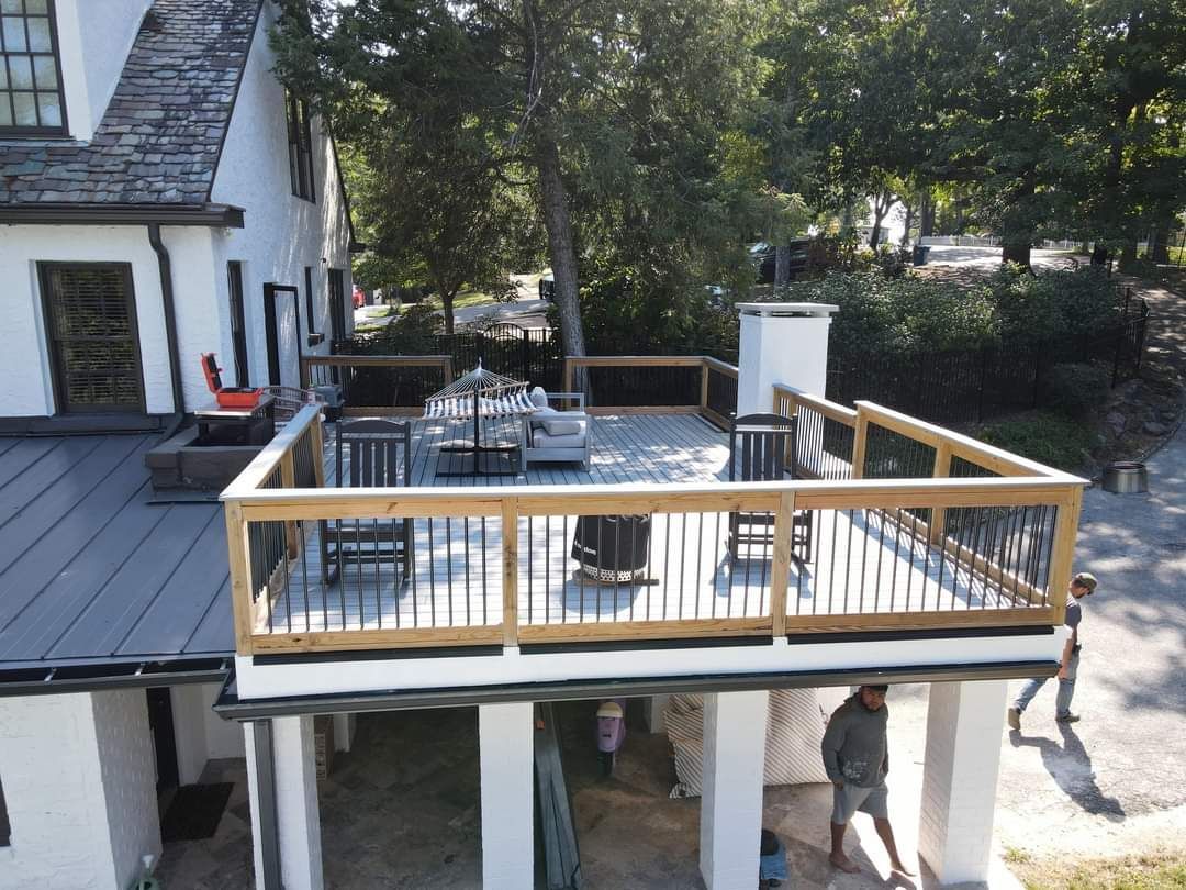 An aerial view of a deck being built on top of a house.