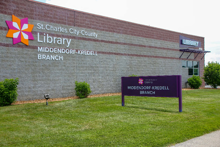 A brick building with a sign that says st. charles city county library