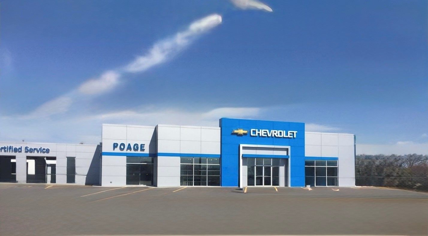 A chevrolet dealership with a blue sign that says peace