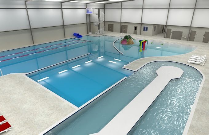 A large indoor swimming pool with a slide in the middle
