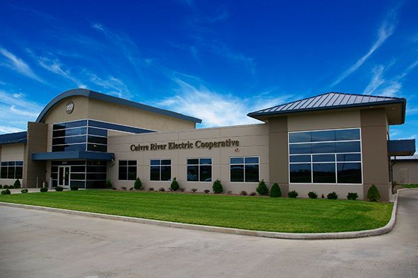 A large building with corn river electric cooperative written on the side