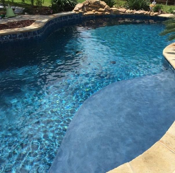 A large swimming pool filled with blue water