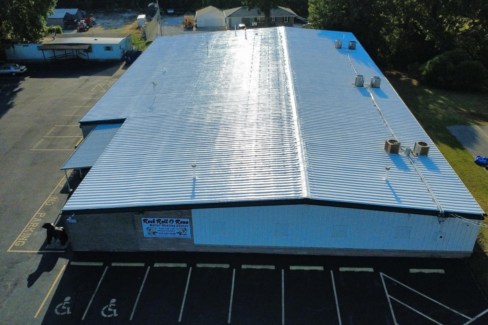 Velux skylight boxes stacked on a wooden pallet on a concrete driveway.