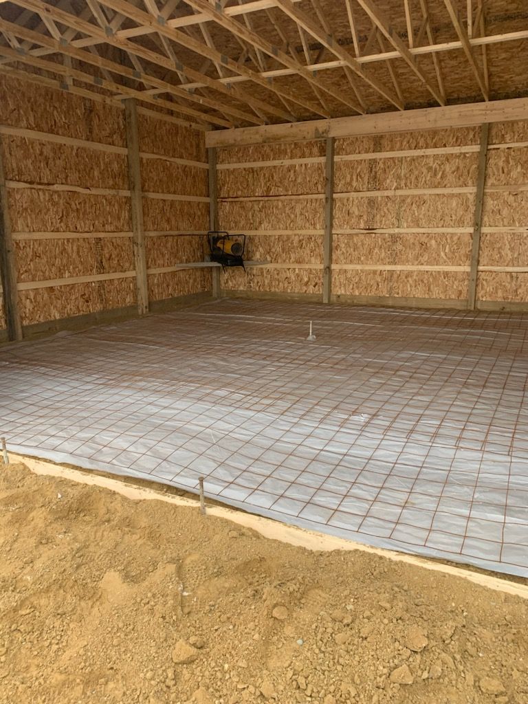 a large concrete floor in a garage under construction