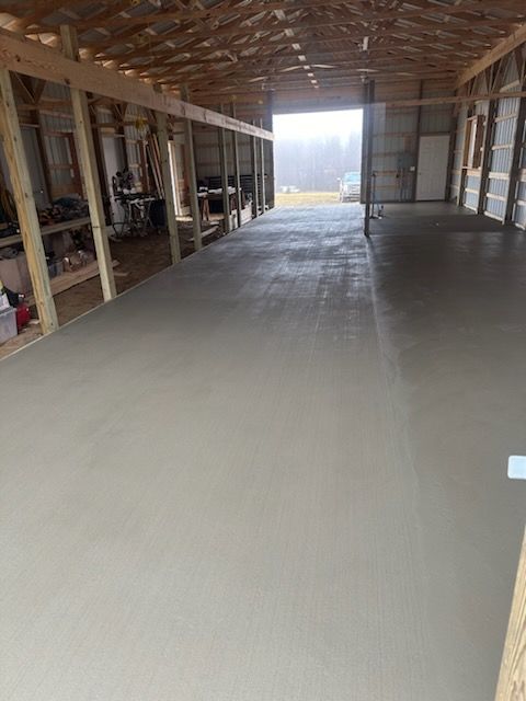 a large concrete floor in a building under construction
