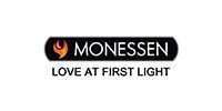 Monessen logo with orange flame icon and slogan “Love at First Light” on black and white background
