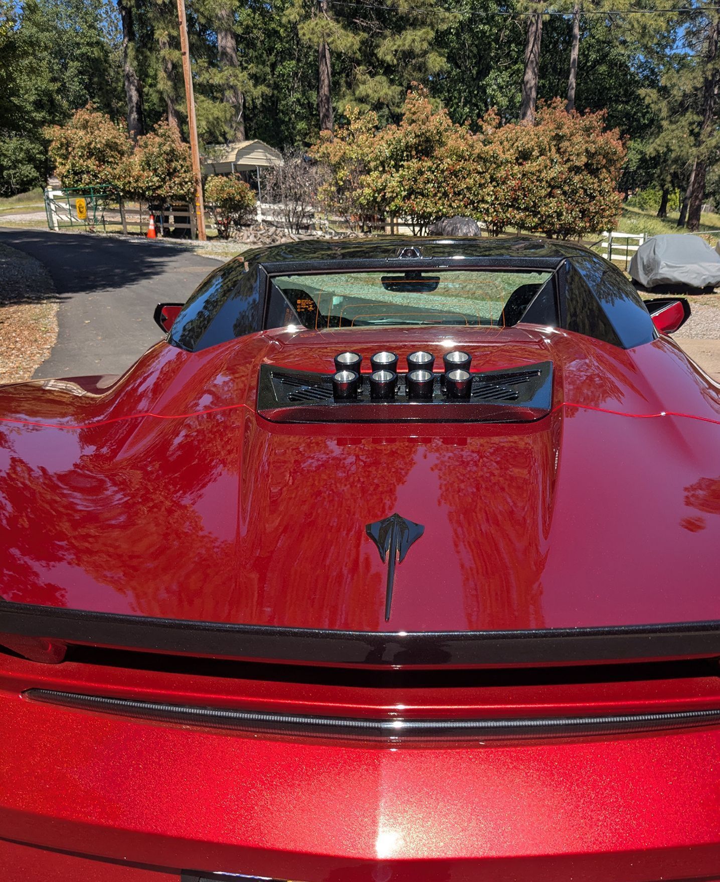 Red sports car with a California license plate